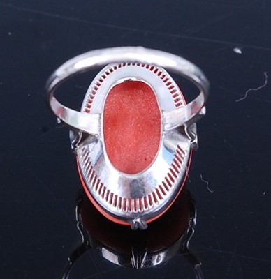 Lot 2781 - A continental white metal coral set dress ring,...