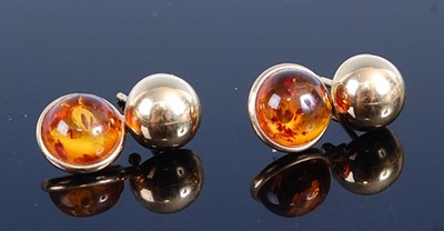 Lot 2784 - A pair of yellow metal and amber set ear studs,...