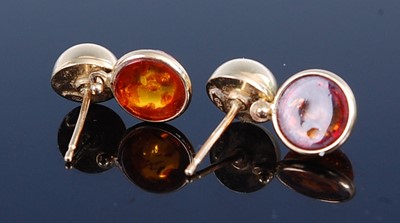 Lot 2784 - A pair of yellow metal and amber set ear studs,...
