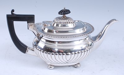 Lot 2165 - A George V silver teapot, of half-reeded oval...