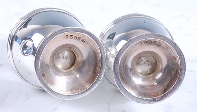 Lot 2166 - A cased pair of Edwardian silver pepperettes,...