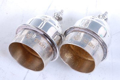 Lot 2166 - A cased pair of Edwardian silver pepperettes,...