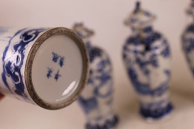 Lot 19 - A garniture of three Chinese export blue and...