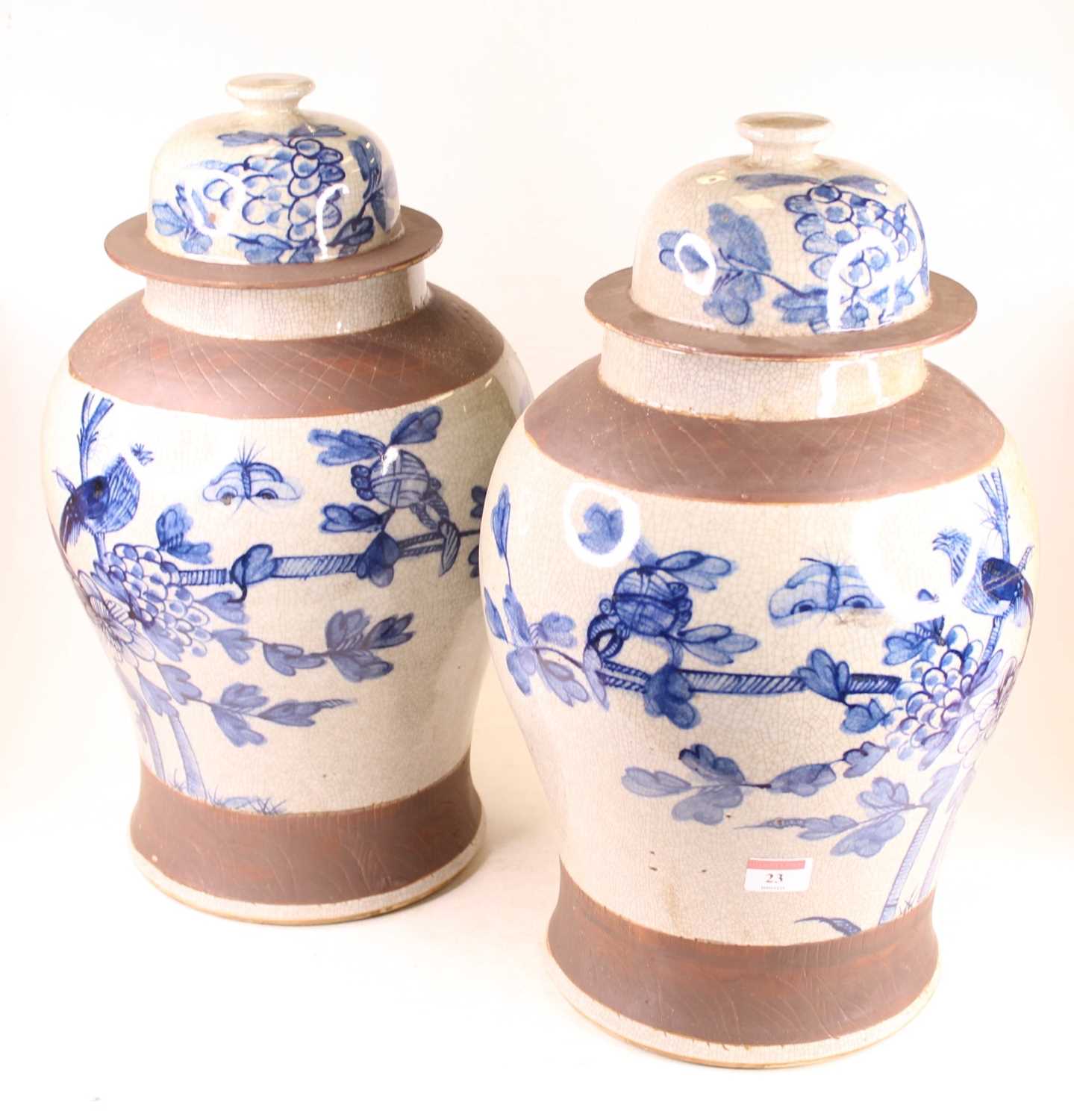 Lot 23 - A pair of large Chinese style vases and covers,...