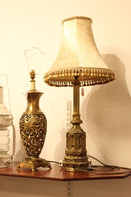 Lot 25 - A modern brass table lamp, of pierced baluster...
