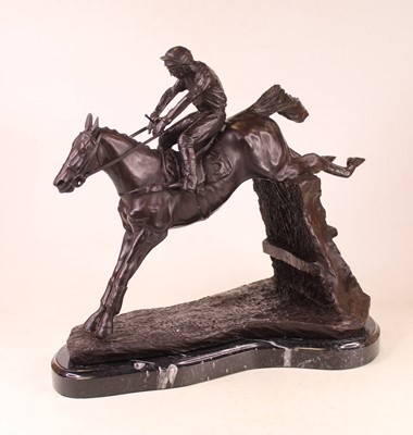 Lot 47 - A large modern bronzed figure of a racehorse...