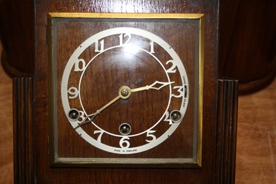 Lot 85 - A 1950s walnut cased mantel clock, having a...