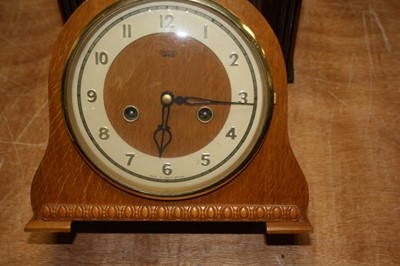 Lot 85 - A 1950s walnut cased mantel clock, having a...