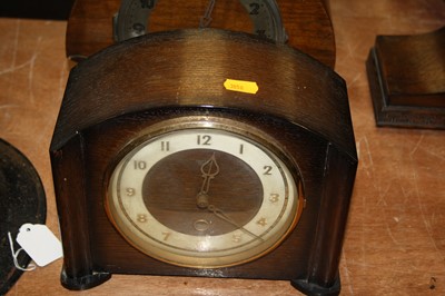Lot 102 - A 1920s oak cased mantel clock, having a...