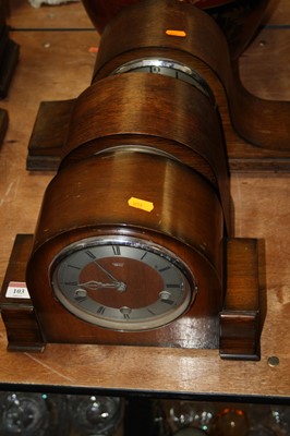 Lot 103 - A 1950s oak cased mantel clock, having a...