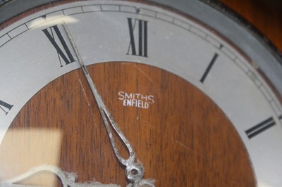 Lot 103 - A 1950s oak cased mantel clock, having a...
