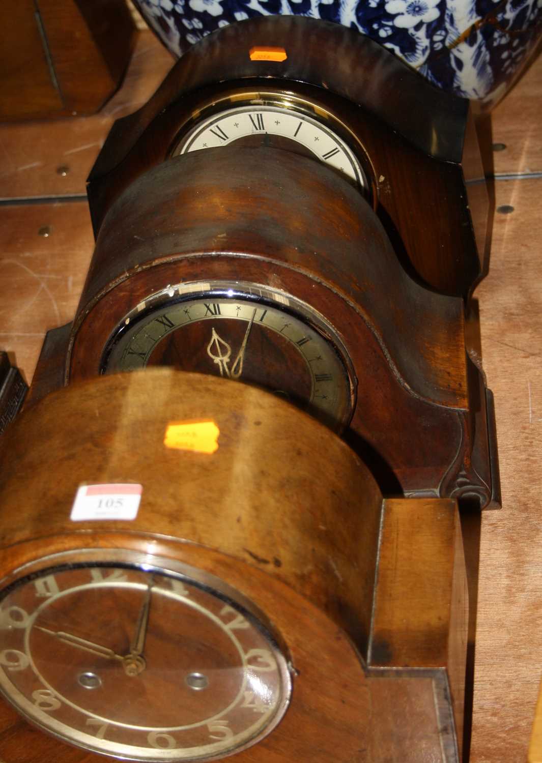 Lot 105 - A 1930s walnut cased mantel clock, having...