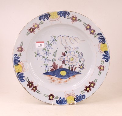Lot 122 - An 18th century English Delft charger, the...