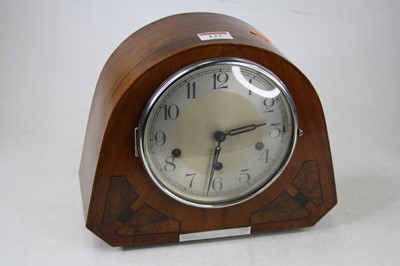 Lot 133 - A 1930s walnut cased mantel clock, having a...