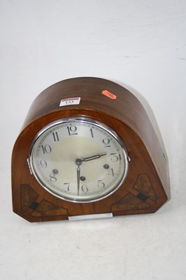 Lot 133 - A 1930s walnut cased mantel clock, having a...