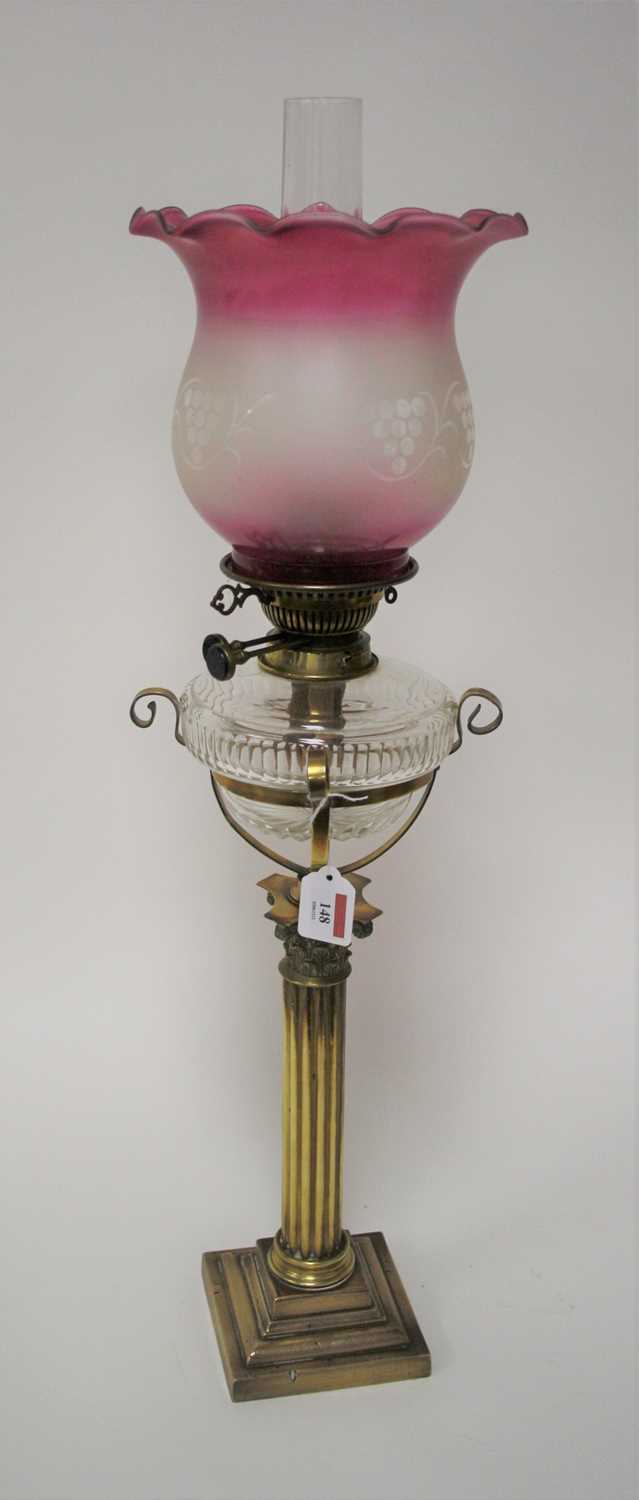 Lot 148 - A Victorian oil lamp, having a later purple...