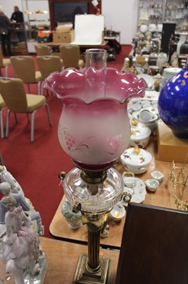 Lot 148 - A Victorian oil lamp, having a later purple...