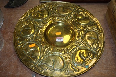 Lot 151 - An Art Nouveau brass charger, of circular form,...
