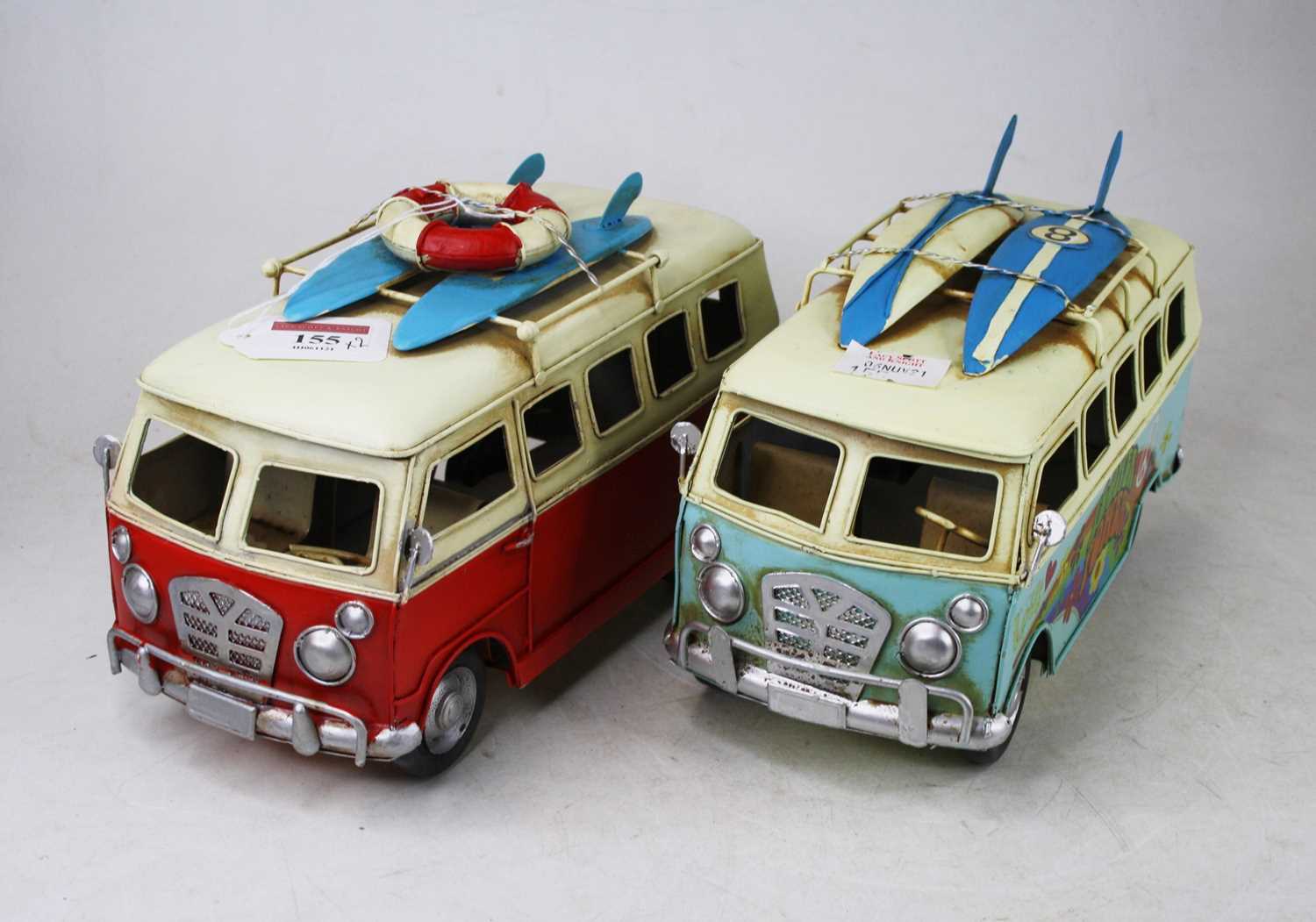Lot 155 - Two painted tin models of Volkswagen camper vans