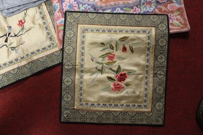 Lot 163 - A pair of silk panels each embroidered with...