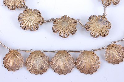 Lot 385 - A pair of filigree gilt flowerhead ear clips...