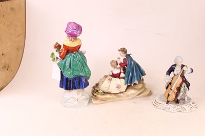 Lot 221 - A porcelain figure modelled as lady in purple...