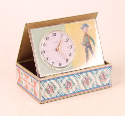 Lot 225 - A Seiko puppet clock in the form of a book,...