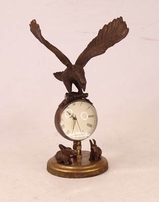 Lot 226 - A reproduction desk clock, the glass cased...