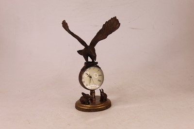 Lot 226 - A reproduction desk clock, the glass cased...