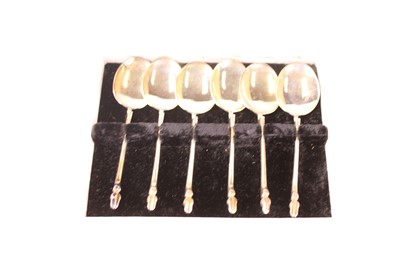 Lot 242 - A cased set of six white metal spoons,...