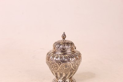 Lot 244 - A Victorian silver canister, the hinged domed...