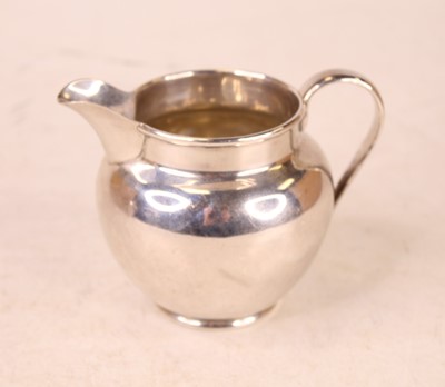 Lot 251 - A George V silver cream jug, of plain...