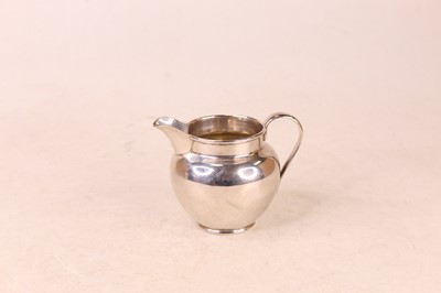 Lot 251 - A George V silver cream jug, of plain...