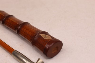 Lot 298 - A white metal mounted opium pipe in bamboo case