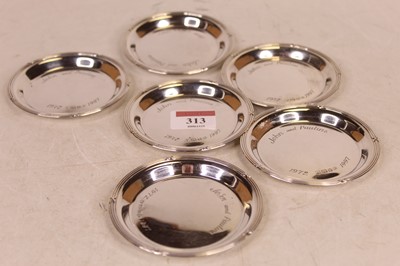 Lot 313 - A set of six modern silver coasters, each with...