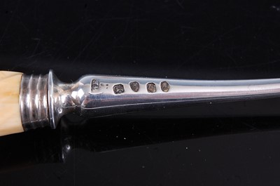 Lot 2100 - A George III silver stilton scoop, of typical...