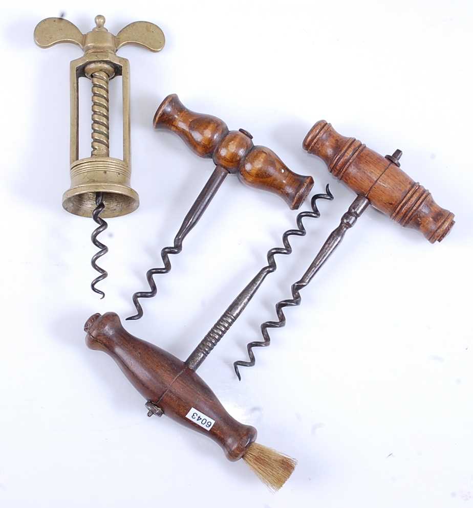 Lot 2284 - A 19th century brass corkscrew, having an open...