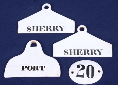 Lot 2288 - A near-pair of glazed porcelain bin labels,...