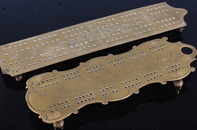 Lot 2428 - * A George III brass cribbage board, of shaped...