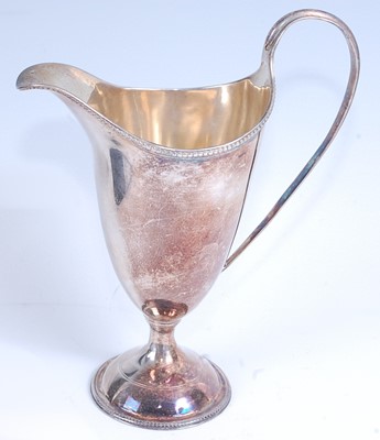 Lot 2099 - A George III silver cream jug, of helmet form,...