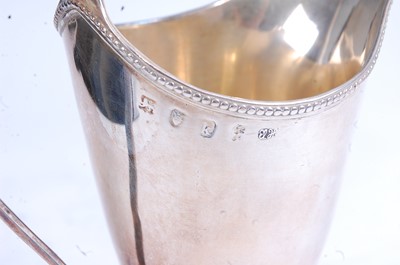 Lot 2099 - A George III silver cream jug, of helmet form,...