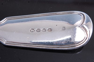 Lot 2089 - A pair of George III silver stuffing spoons in...