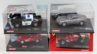 Lot 1458 - 4 boxed Carrera Evolution 1/32 scale slot cars...