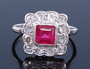 Lot 2309 - A white metal, ruby and diamond square cluster...