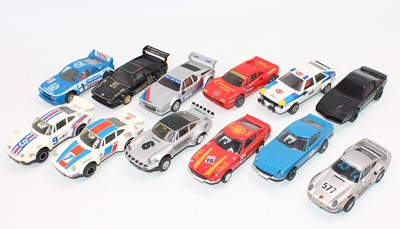 Lot 1465 - 12 unboxed Scalextric slot cars to include,...