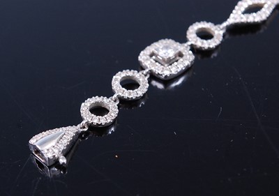 Lot 2340 - An 18ct white gold diamond fancylink bracelet,...