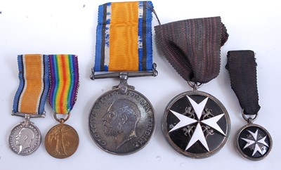 Lot 30 - A WW I British War medal, naming REV W F M...