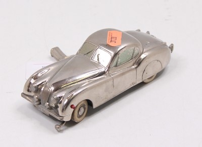 Lot 1489 - Prameta Chrome clockwork model of a Jaguar...