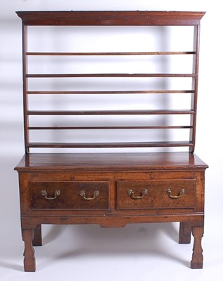 Lot 2587 - An 18th century joined oak dresser, having a...