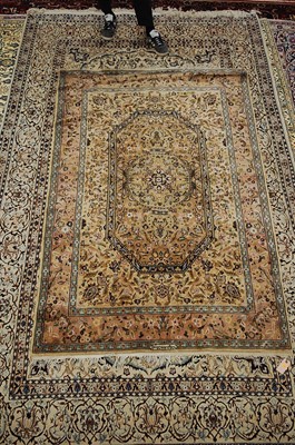 Lot 2588 - A Persian woollen rug, the central brown...